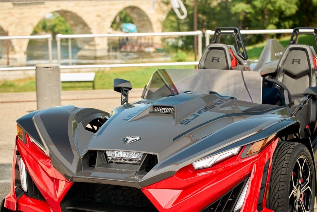 Front end of a red and grey Polaris Slingshot